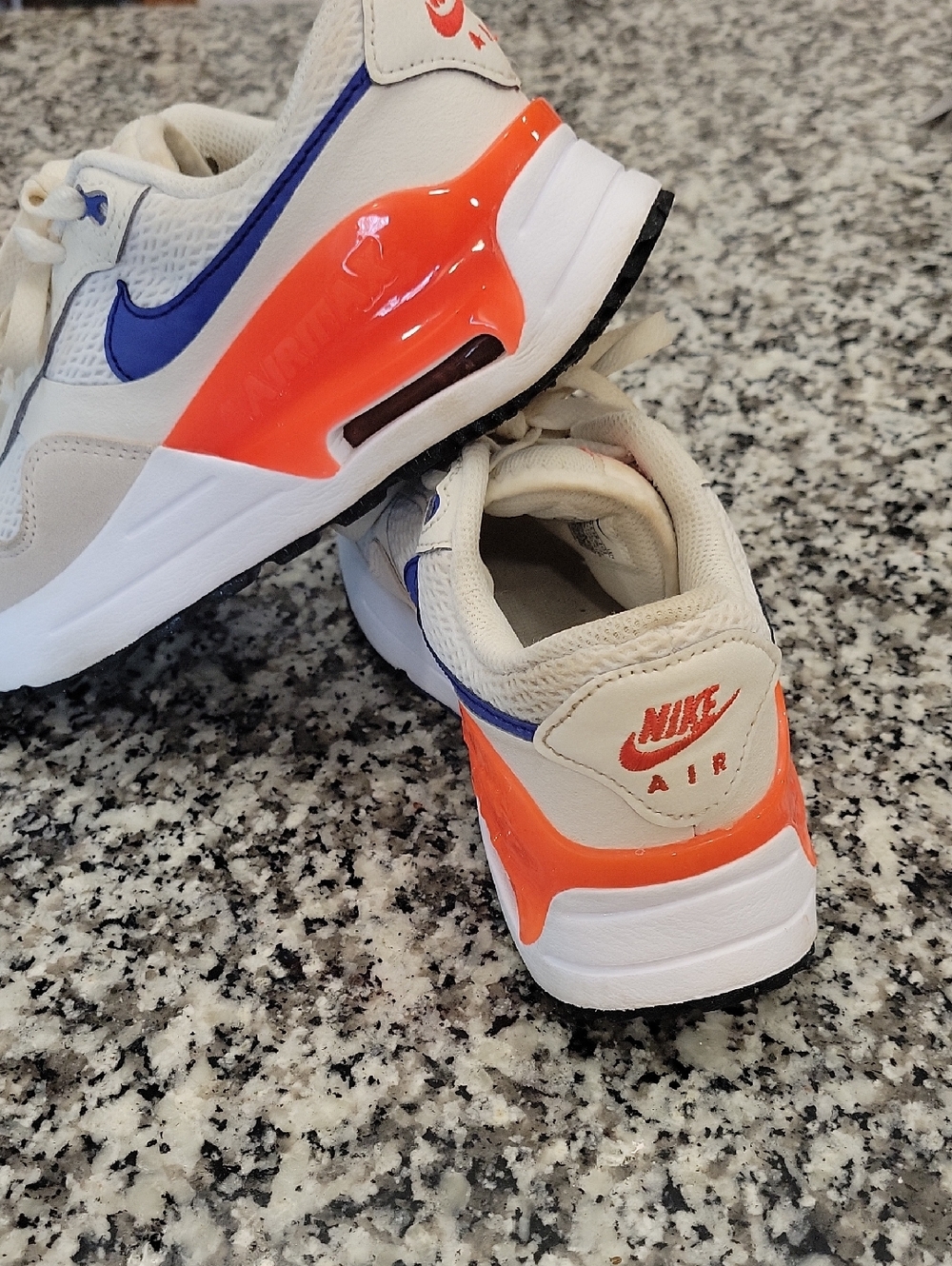 Nike Women’s Athletic Shoes White with Orange and Blue Details